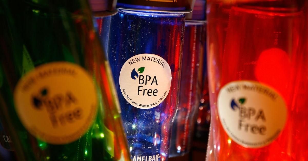 Three colorful plastic water bottles with BPA-free stickers on them