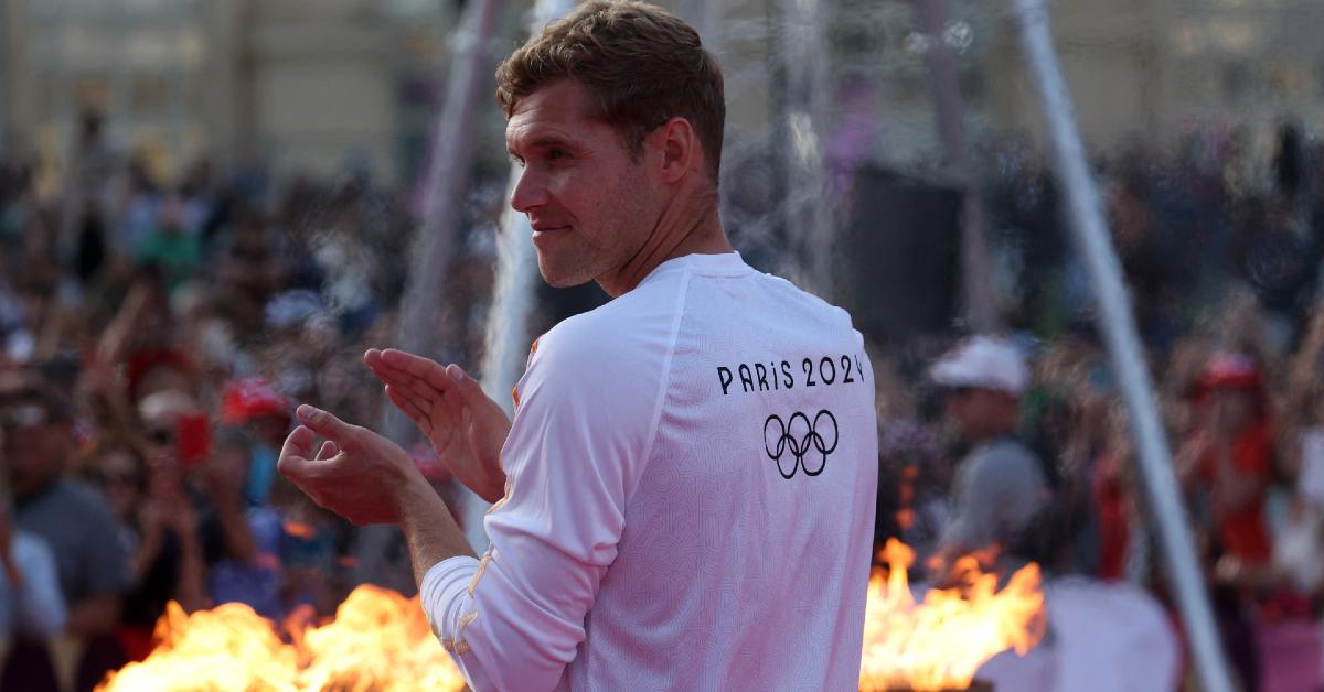 French decathlon Olympian Kevin Mayer at the Olympic torch relay ceremony in May 2024